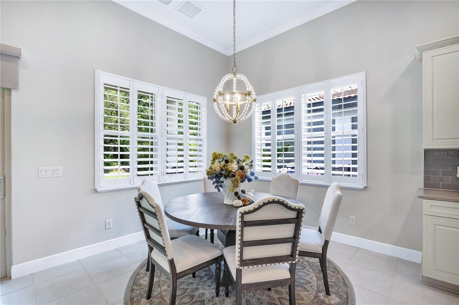 Charming dining space offering a comfortable setting for everyday meals and special occasions. - 15749 CUTTER SAIL PL, WINTER GARDEN