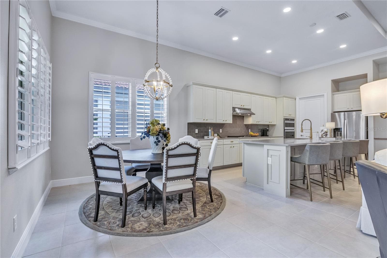 Inviting dining space designed for everyday living and entertaining. - 15749 CUTTER SAIL PL, WINTER GARDEN
