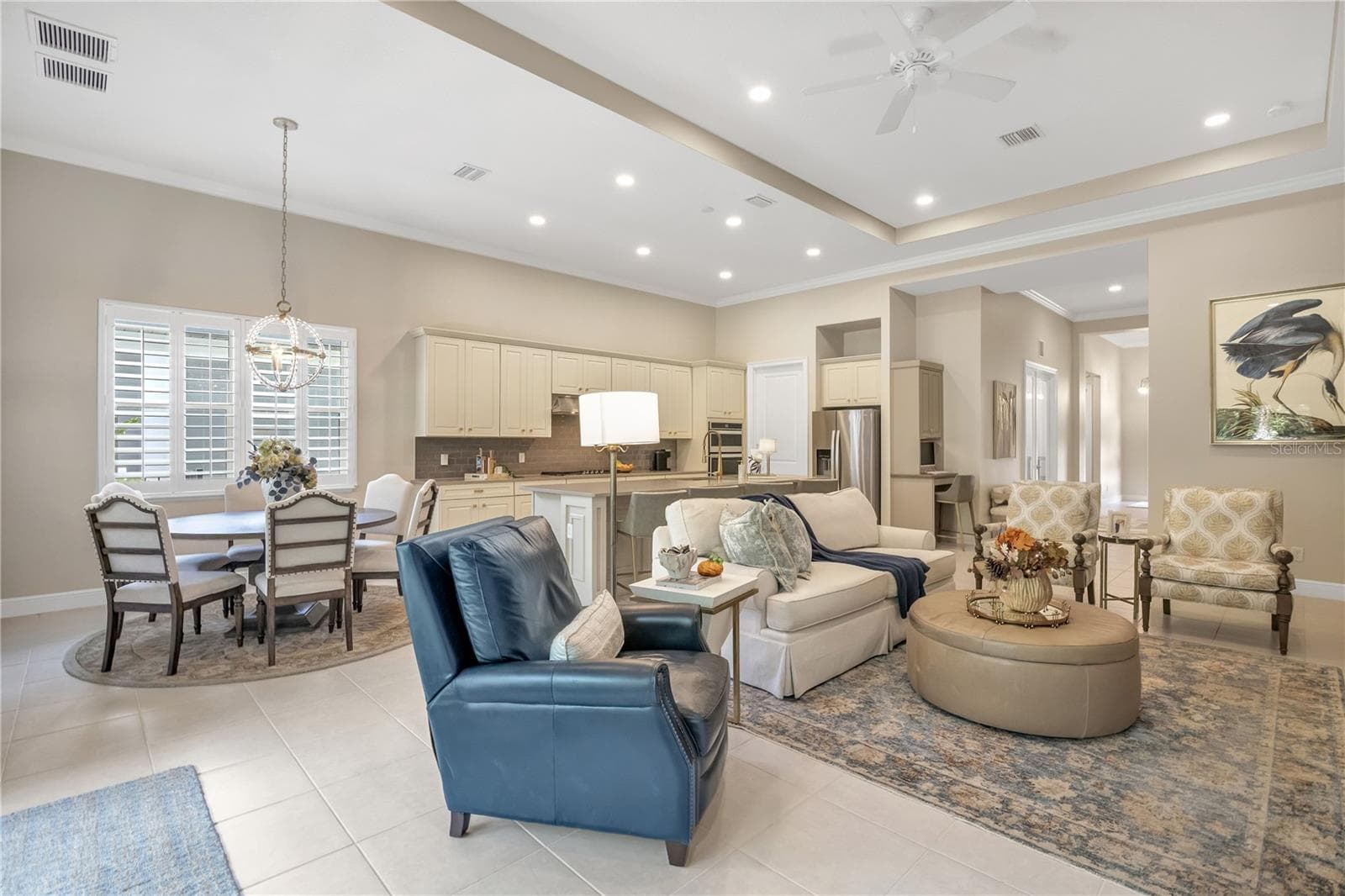 Spacious living area filled with natural light, perfect for relaxing or entertaining. - 15749 CUTTER SAIL PL, WINTER GARDEN