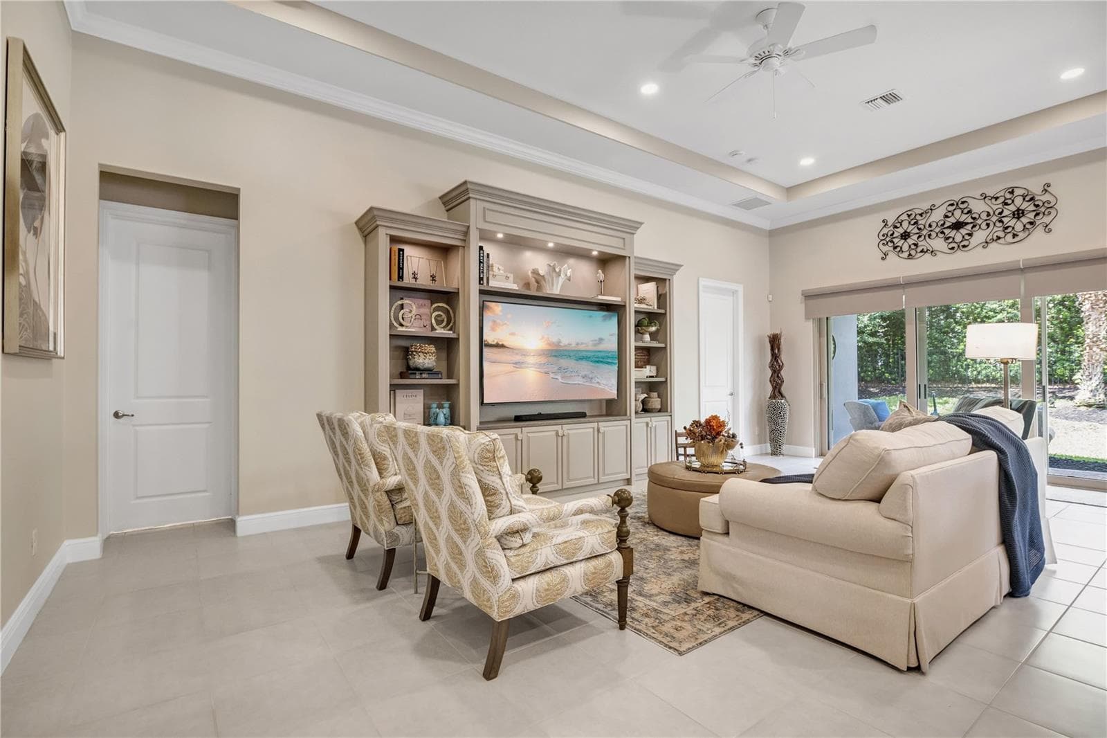 Spacious living area with beautiful finishes and abundant natural light. - 15749 CUTTER SAIL PL, WINTER GARDEN
