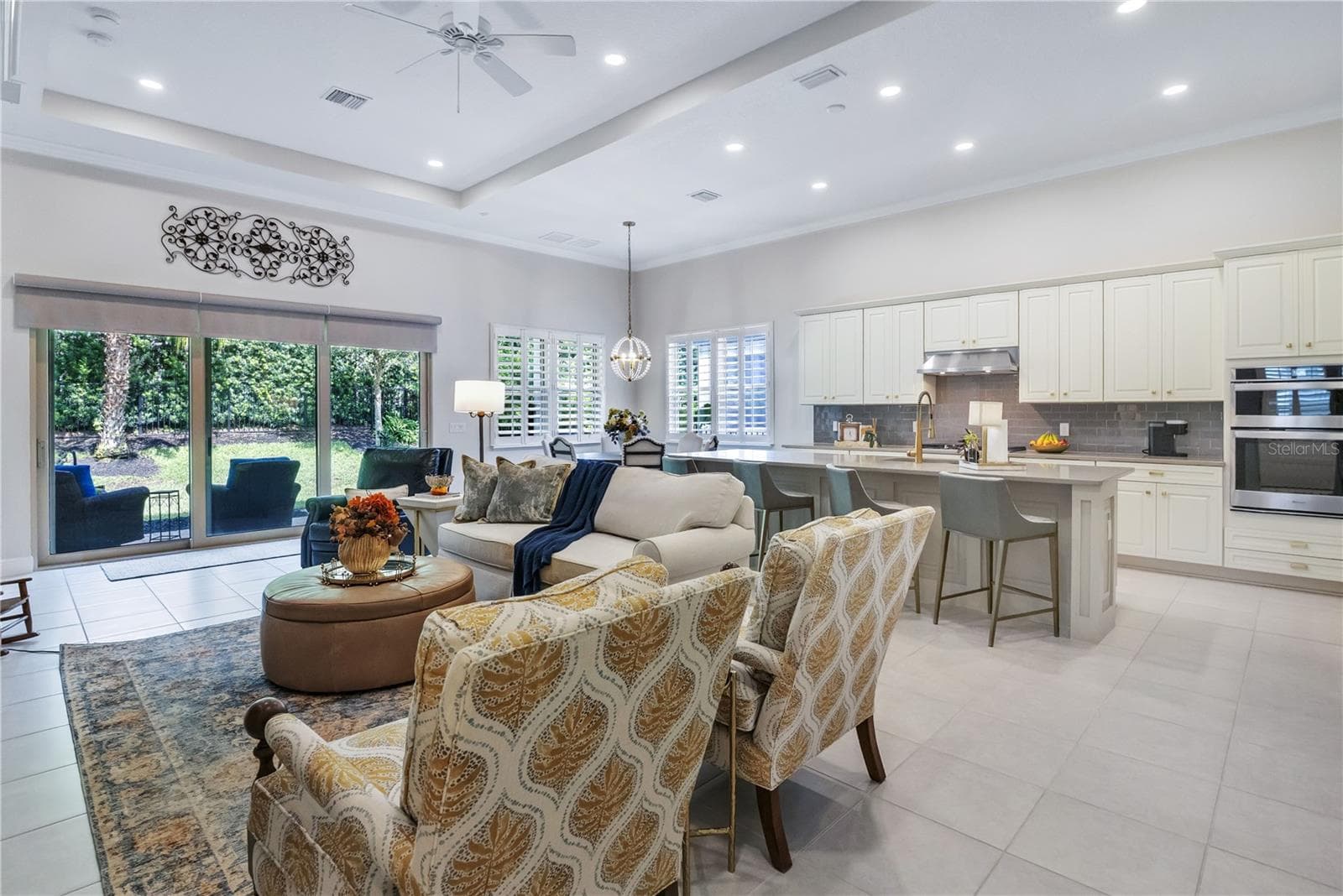 Spacious living area with beautiful finishes and abundant natural light. - 15749 CUTTER SAIL PL, WINTER GARDEN