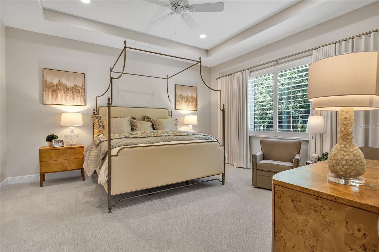 Elegant primary suite offering a peaceful retreat with sophisticated finishes. - 15749 CUTTER SAIL PL, WINTER GARDEN
