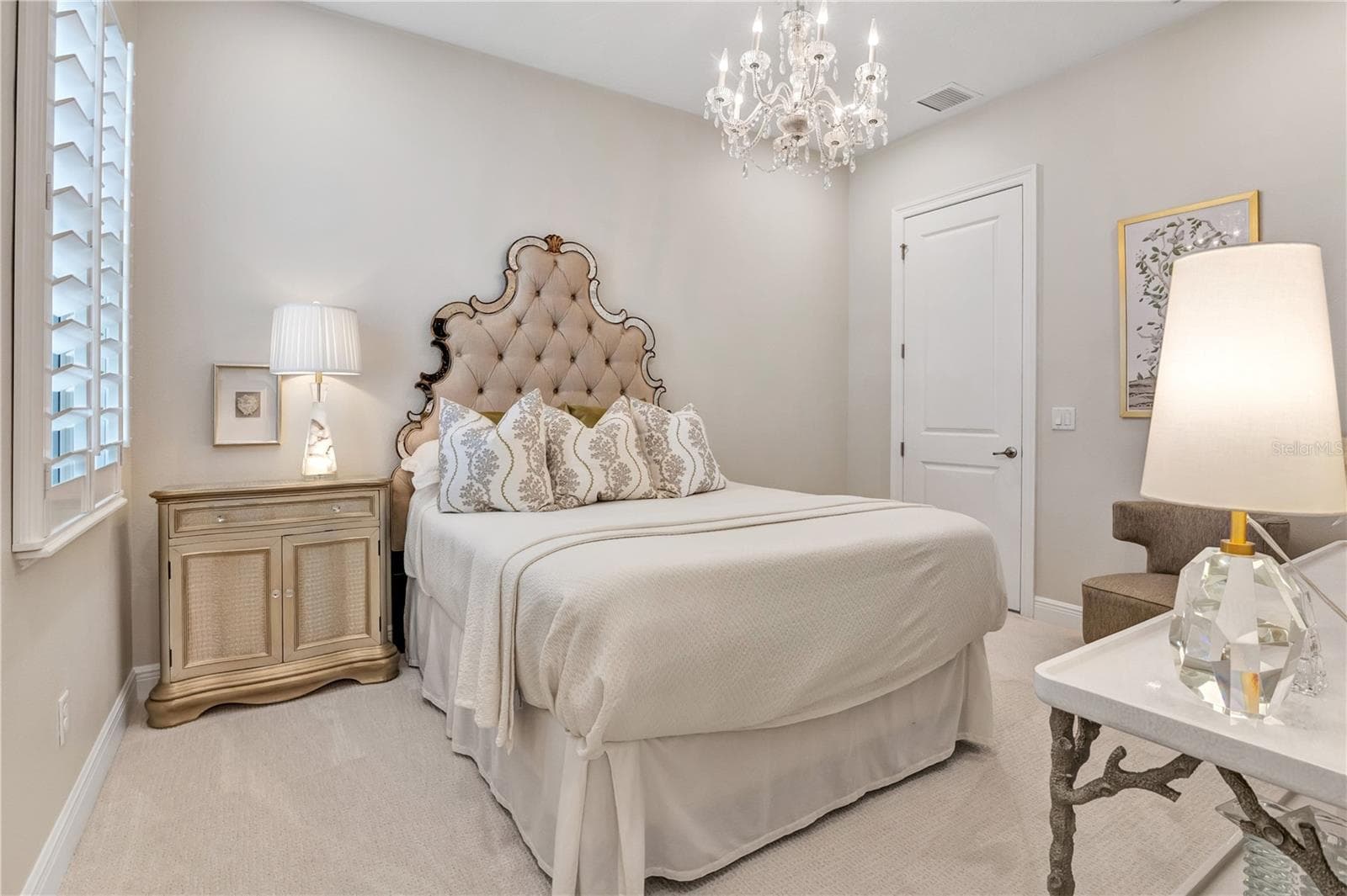 Another perspective highlighting the bedroom's elegant details and neutral finishes. - 15749 CUTTER SAIL PL, WINTER GARDEN