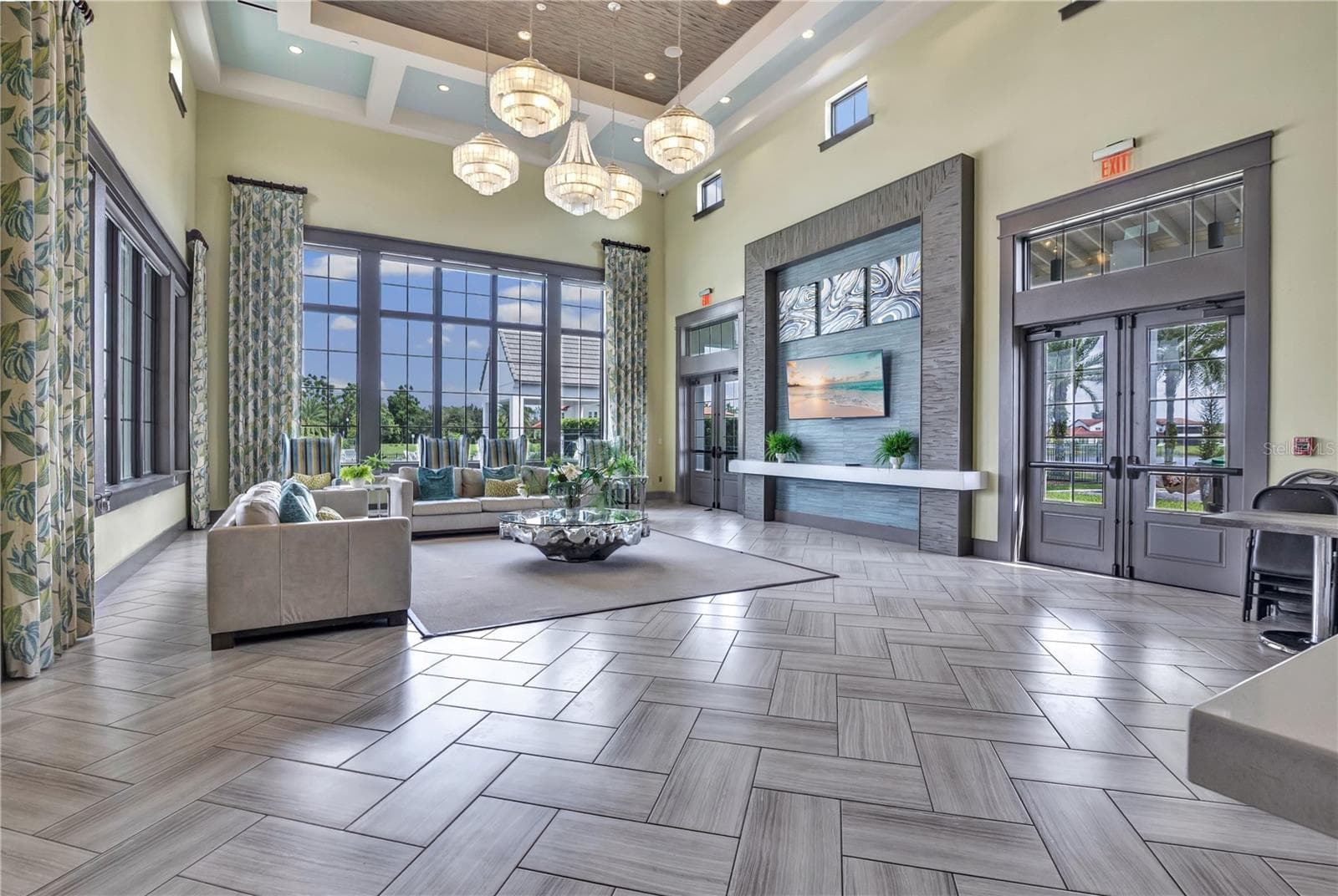 Elegant community clubhouse featuring impressive architectural details and inviting gathering spaces. - 15749 CUTTER SAIL PL, WINTER GARDEN
