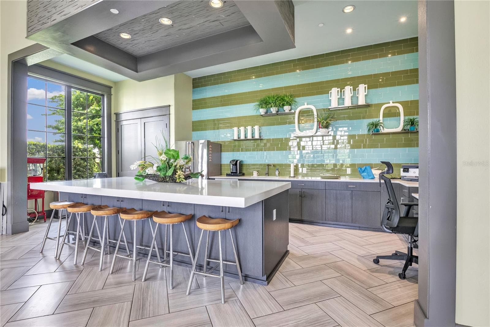 Elegant community clubhouse featuring impressive architectural details and inviting gathering spaces. - 15749 CUTTER SAIL PL, WINTER GARDEN