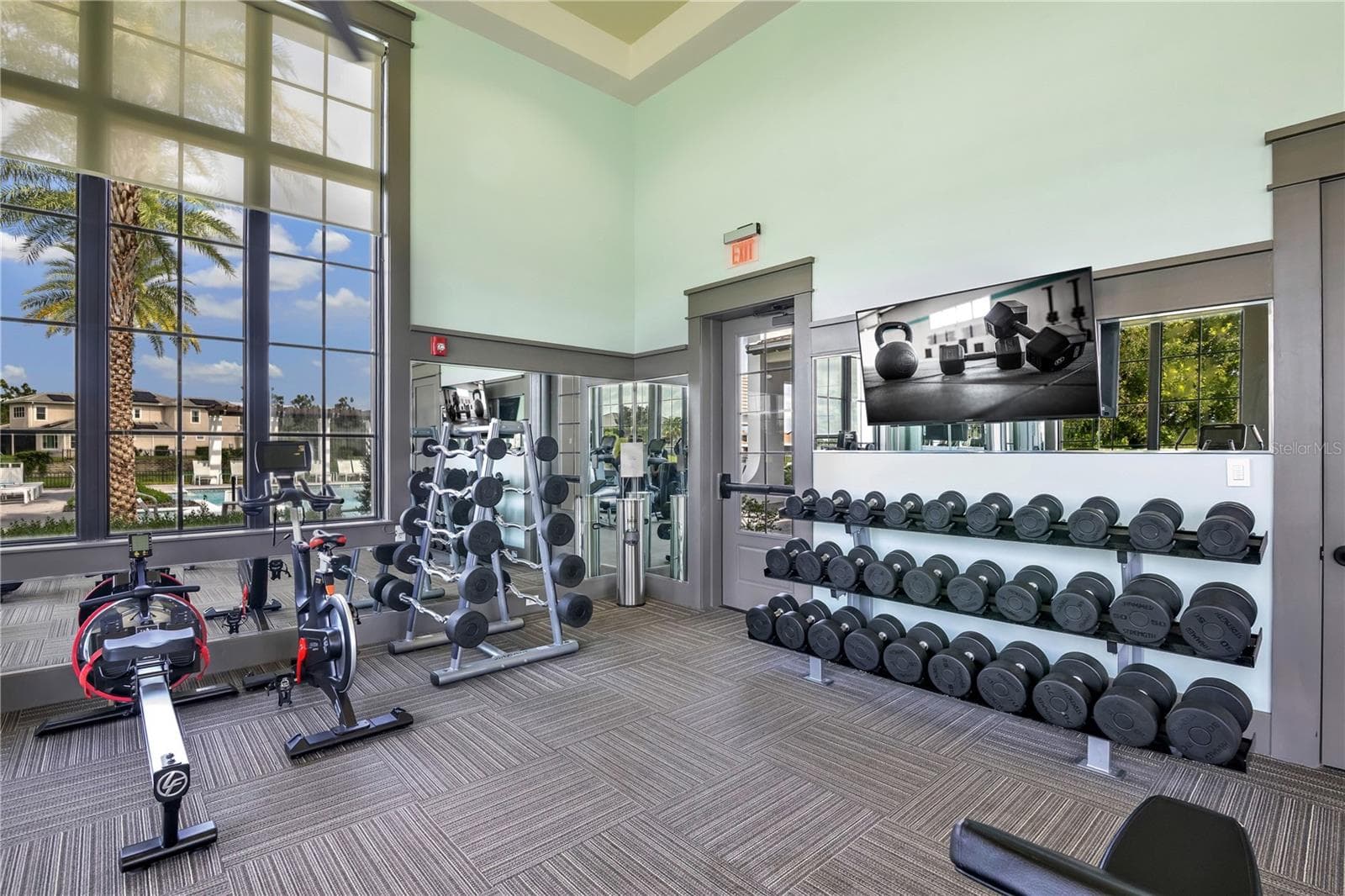 Well-equipped community fitness center with cardio and strength-training equipment. - 15749 CUTTER SAIL PL, WINTER GARDEN
