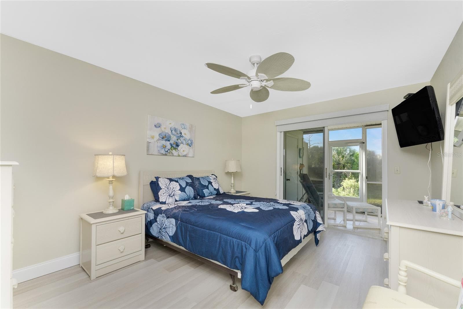 Primary Bedroom has sliding glass doors opening onto the lanai - 6600 GASPARILLA PINES BLVD ##14-103, ENGLEWOOD