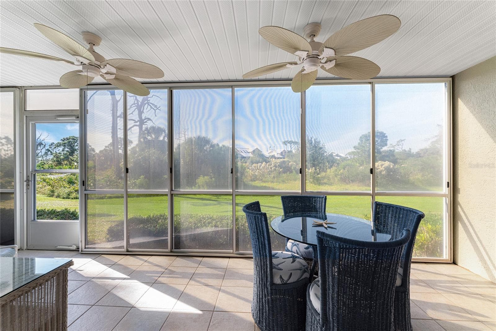 Vinyl enclosed lanai overlooks Wildflower Preserve. - 6600 GASPARILLA PINES BLVD ##14-103, ENGLEWOOD