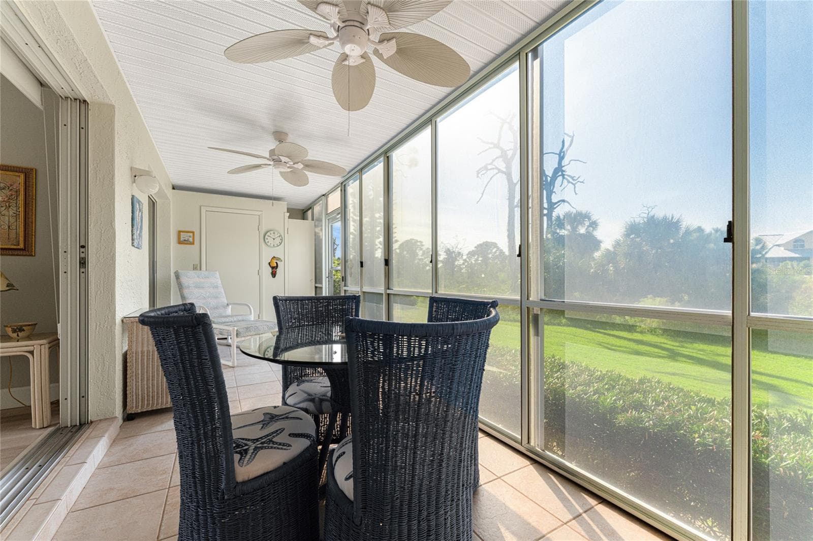 Vinyl enclosed lanai overlooks Wildflower Preserve. - 6600 GASPARILLA PINES BLVD ##14-103, ENGLEWOOD