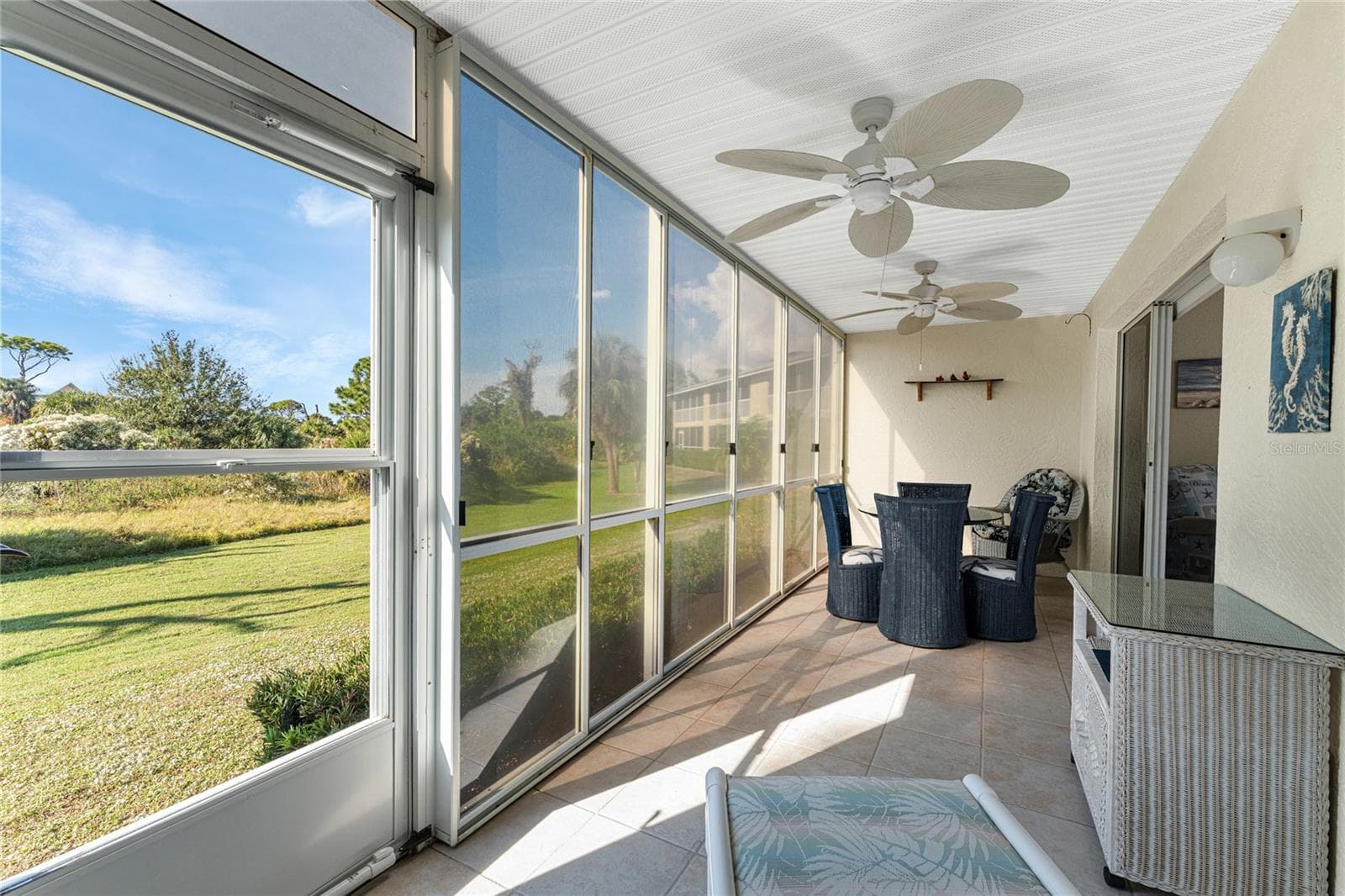 Vinyl enclosed lanai overlooks Wildflower Preserve. - 6600 GASPARILLA PINES BLVD ##14-103, ENGLEWOOD