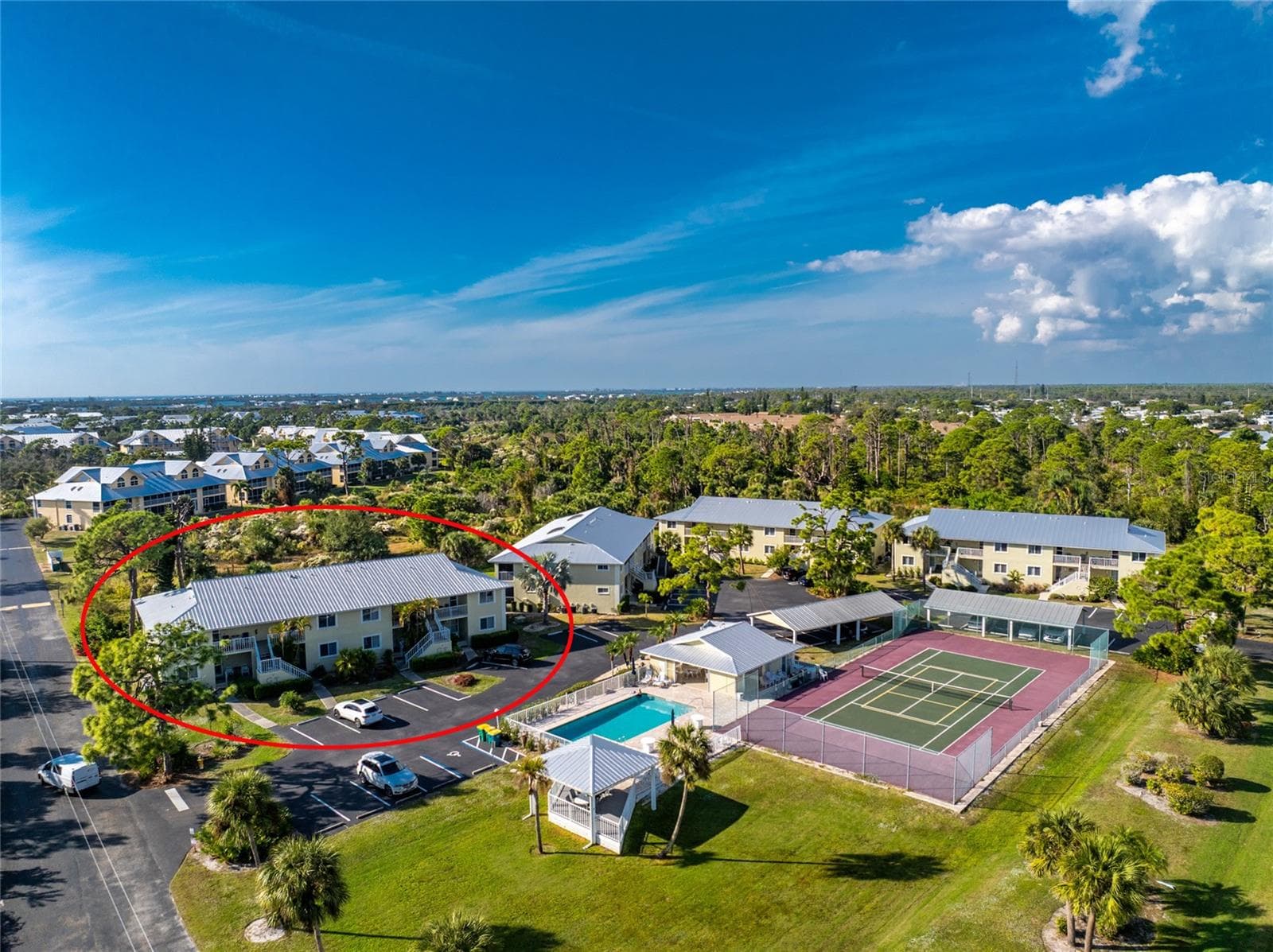 Aerial #2 - notice that you are across the parking area from the clubhouse & pool and tennis/pickleball courts! - 6600 GASPARILLA PINES BLVD ##14-103, ENGLEWOOD