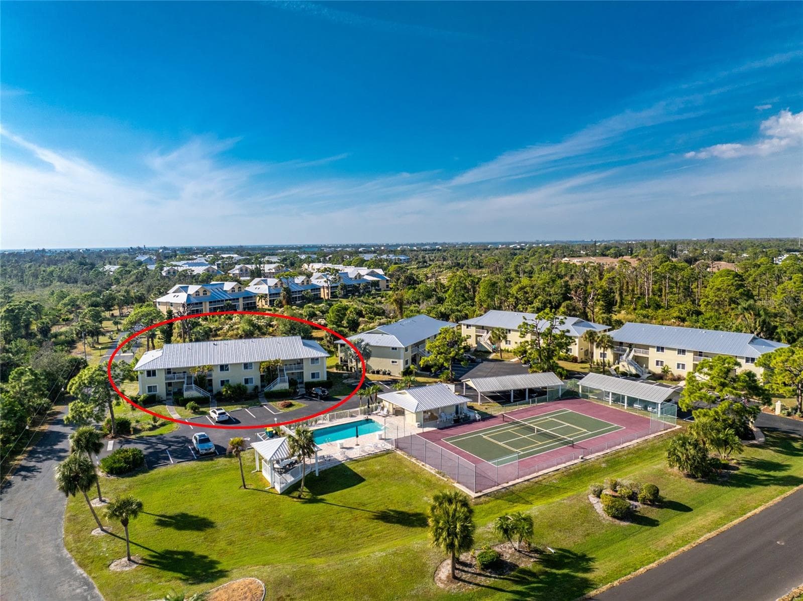 Aerial #3 - notice that you are across the parking area from the clubhouse & pool and tennis/pickleball courts! - 6600 GASPARILLA PINES BLVD ##14-103, ENGLEWOOD