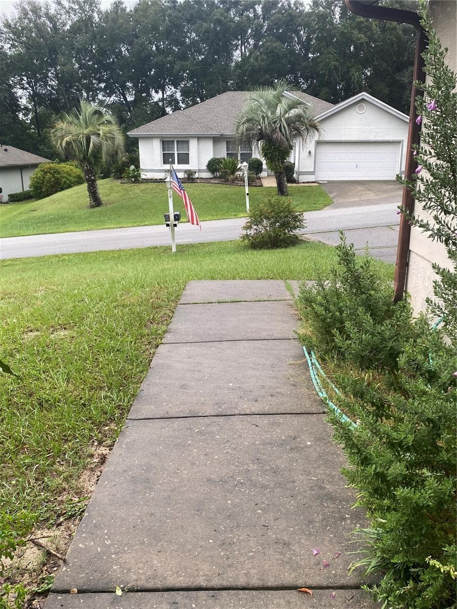 Walkway to the entrance of the house. View from the front of the house. - 11492 SW 82ND COURT RD, OCALA