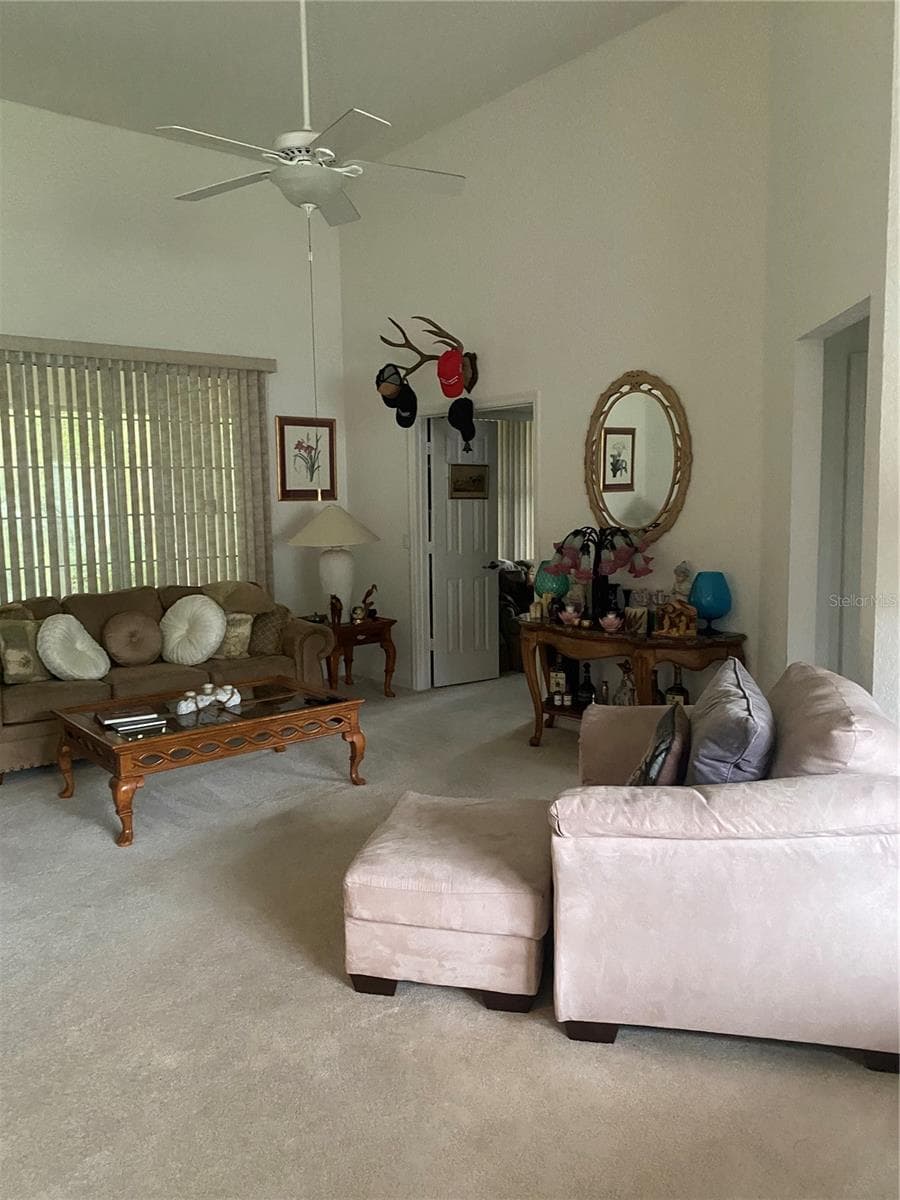 Living room area, large area, comfortable space. - 11492 SW 82ND COURT RD, OCALA