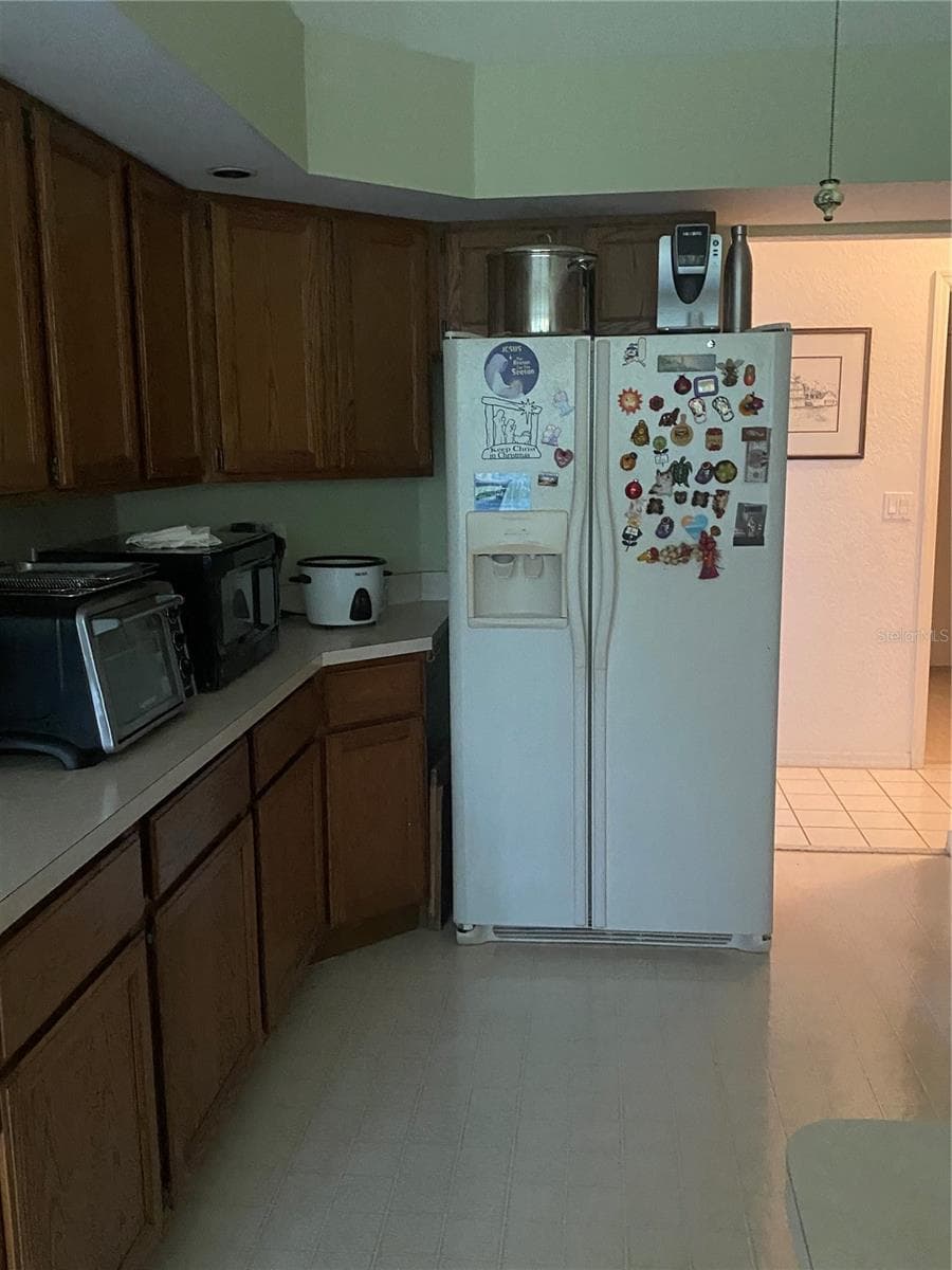 Open kitchen with plenty of cabinets and drawers, plenty of counterspace for small appliances. - 11492 SW 82ND COURT RD, OCALA