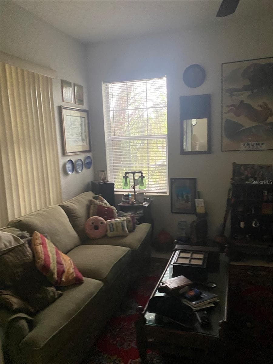Den room with high ceiling, ceiling fan with big windows - 11492 SW 82ND COURT RD, OCALA