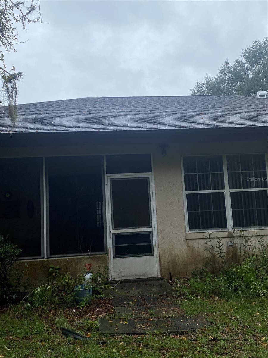 Back door of the screened in lanai area - 11492 SW 82ND COURT RD, OCALA