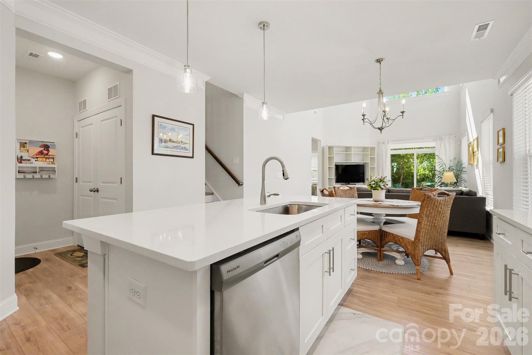 The kitchen flows to the dining area and then continues into the two story great room. - 4159 Black Court, Harris
