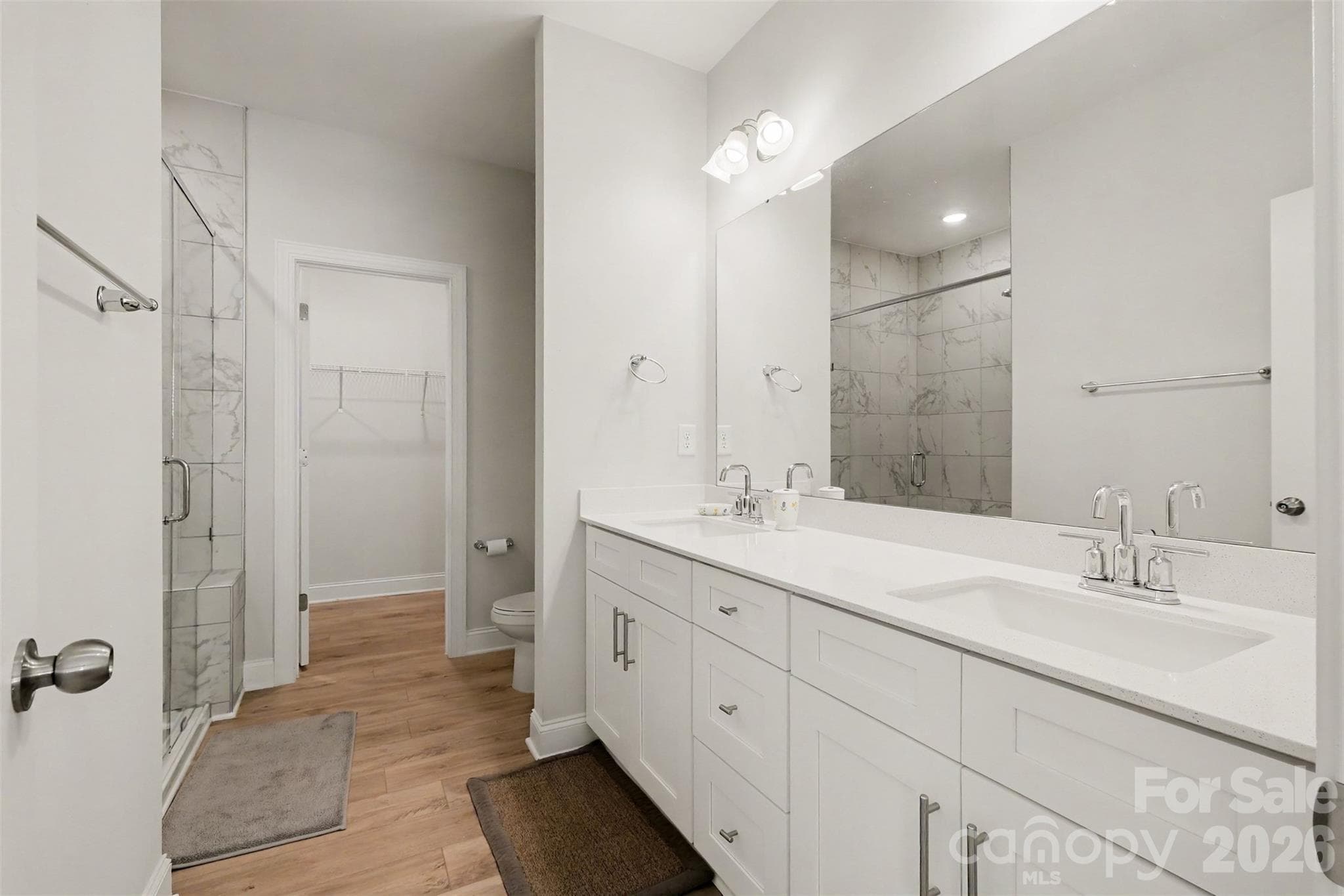 Double sinks, frameless glass shower and large walk in closet off the primary. - 4159 Black Court, Harris