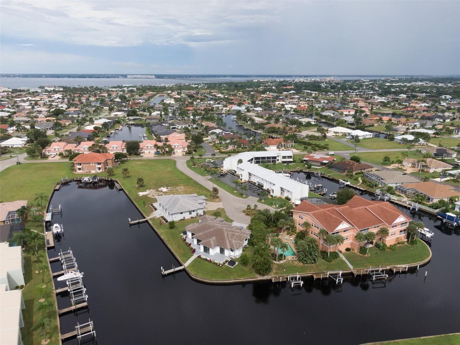Front of building (white building on right) - 1318 WESLEY DR #124B, PUNTA GORDA