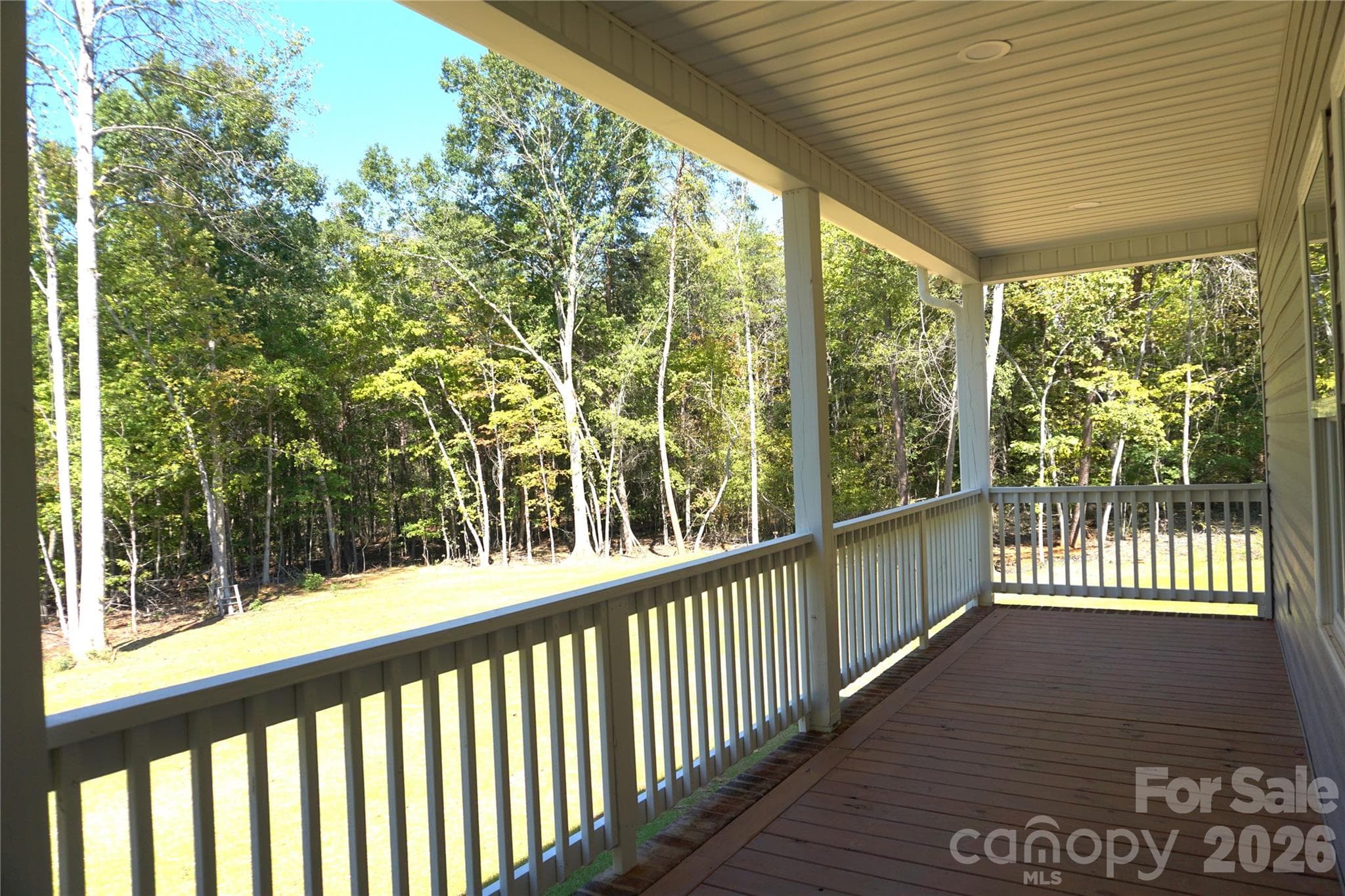 Large back covered porch overlooking the large backyard. - 989 Rhyne Road, Clover