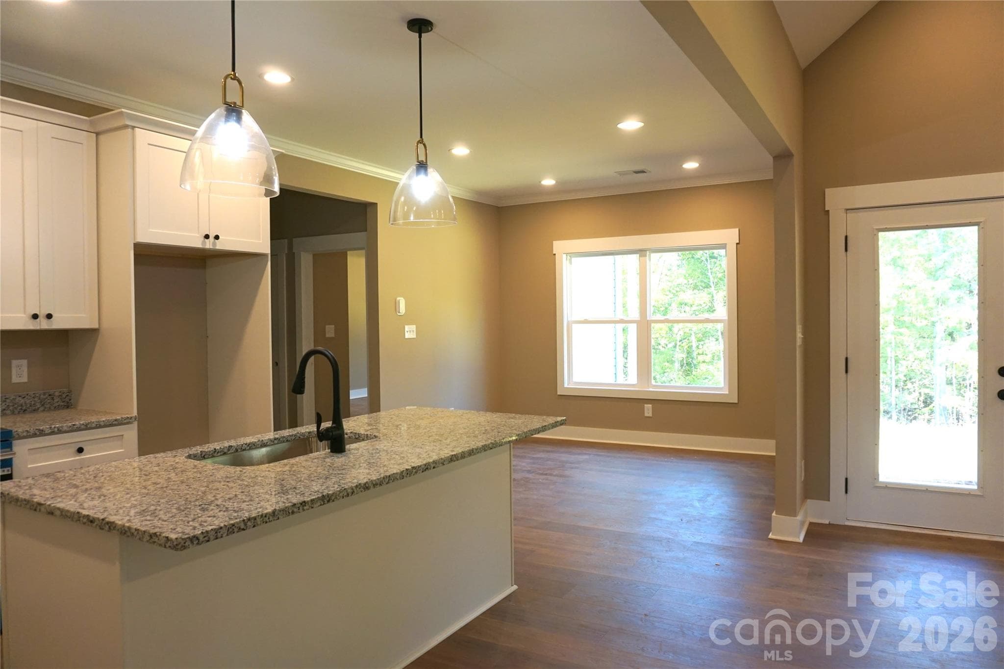 Dinette area located off the kitchen overlooking the back yard. - 989 Rhyne Road, Clover