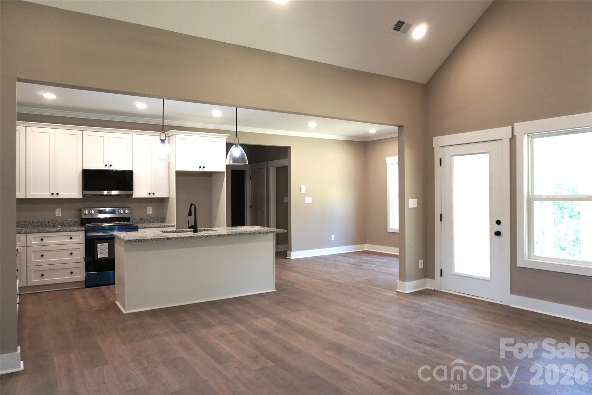 Exterior door off the family room leads to the beautiful back covered porch. - 989 Rhyne Road, Clover