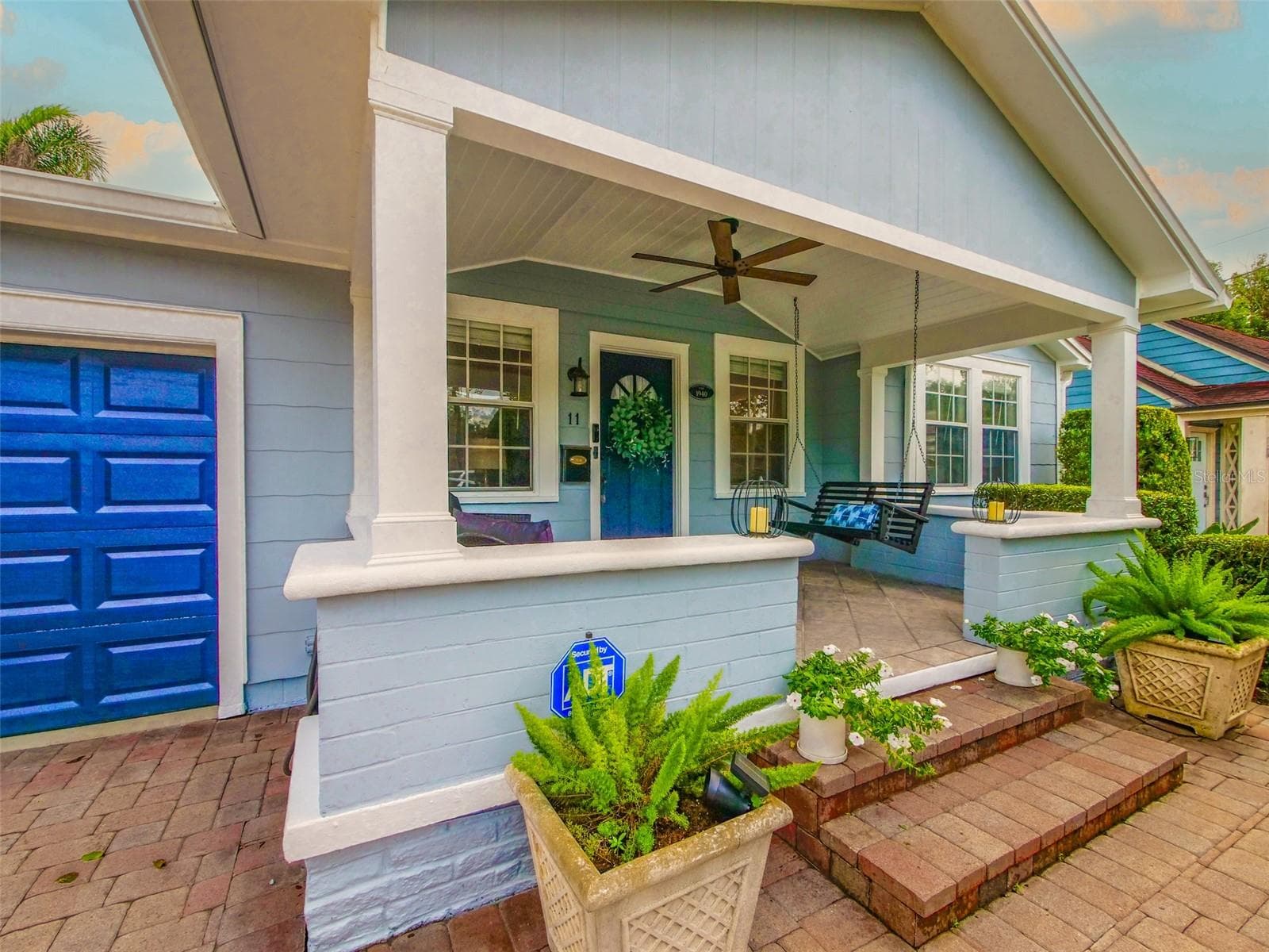 Covered front porch with ceiling fan and porch swing - 11 S LAWSONA BLVD, ORLANDO