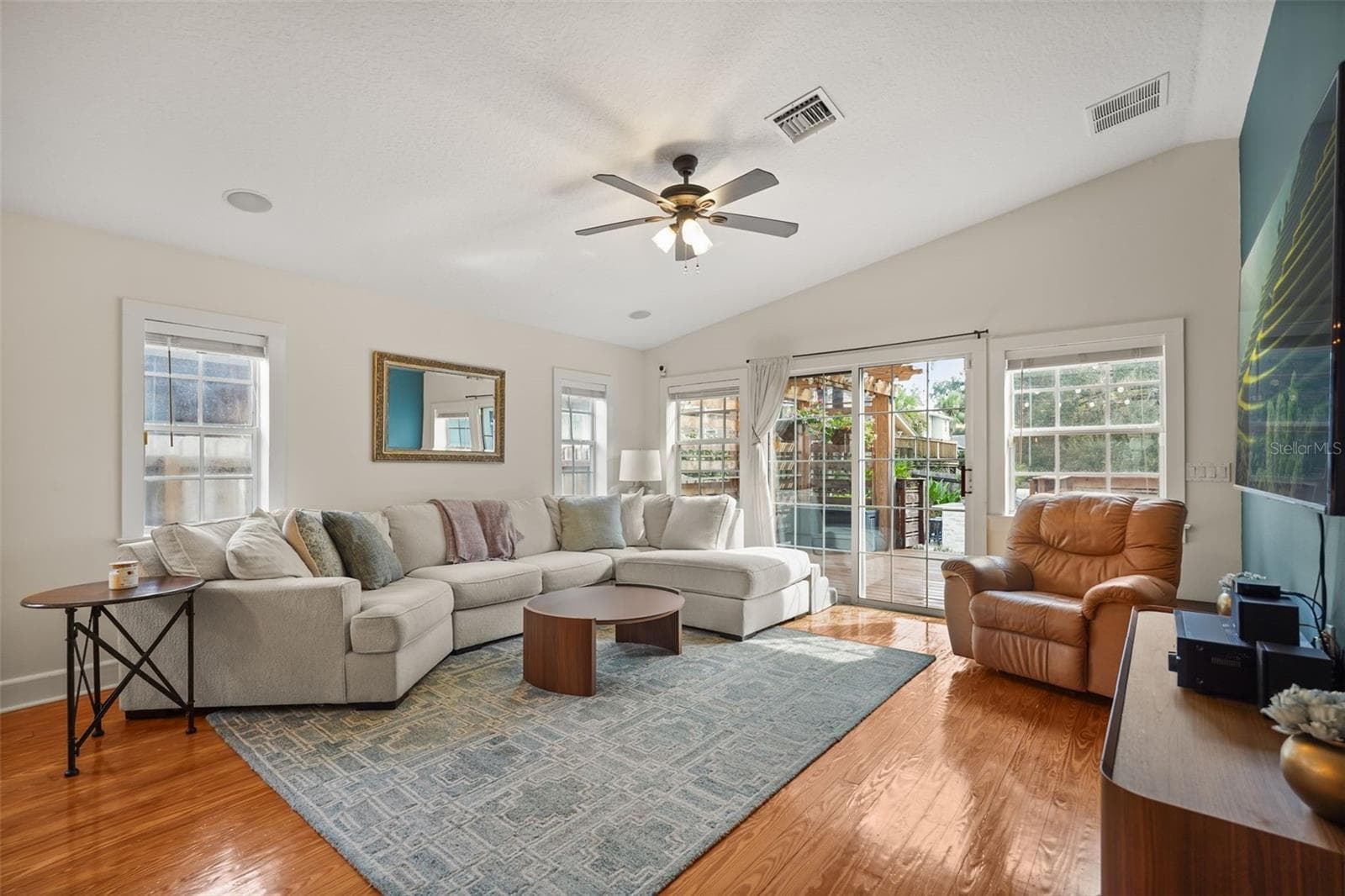 Living room with sliding glass doors to the rear deck - 11 S LAWSONA BLVD, ORLANDO