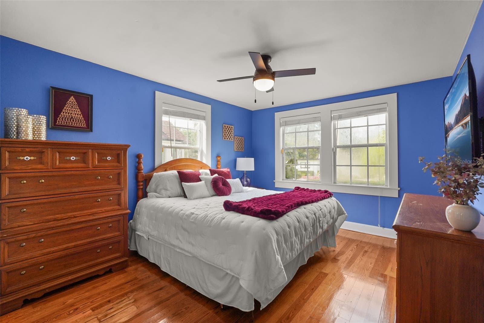 Bedroom with wood floors and ceiling fan - 11 S LAWSONA BLVD, ORLANDO