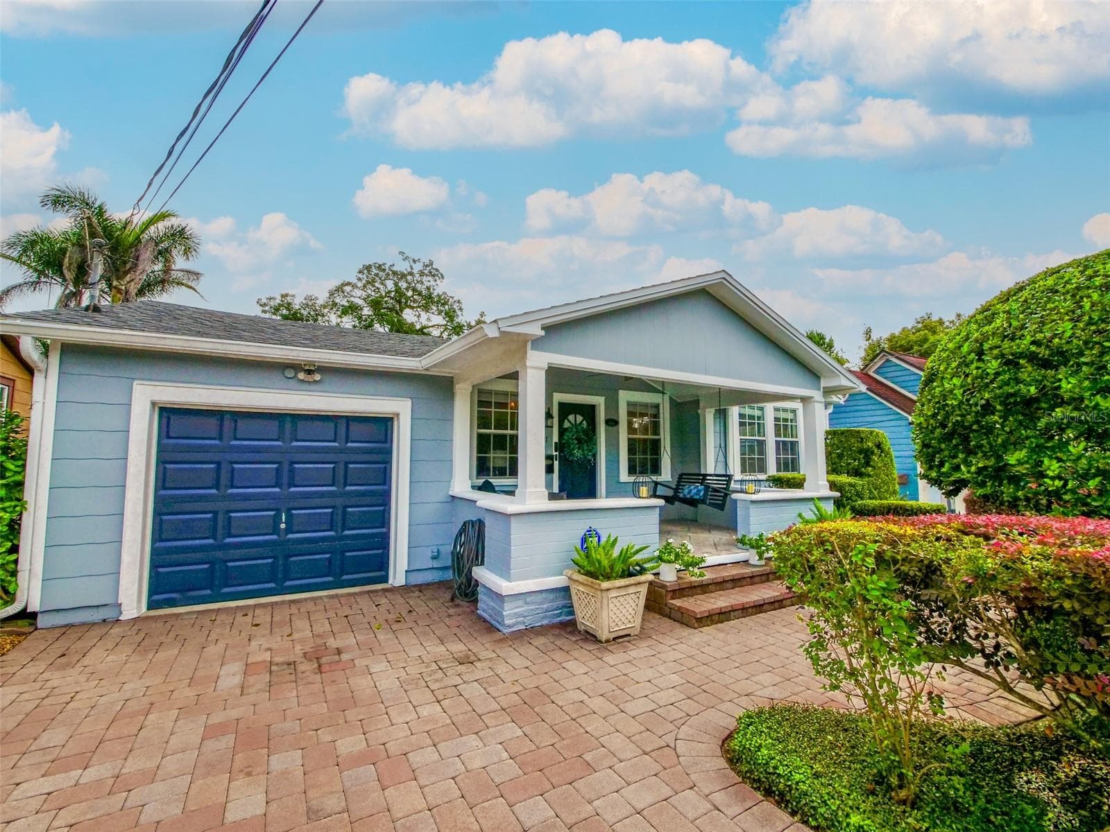 Front exterior with garage and covered porch - 11 S LAWSONA BLVD, ORLANDO
