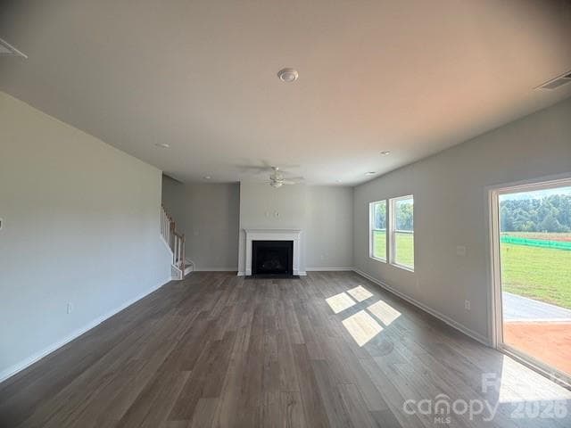 Spacious Family Room with Fireplace as well as covered rear patio can be seen - 4025 Juno Drive, Charlotte