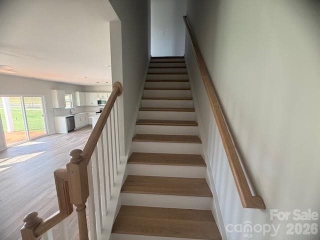 Oak Stairs leading to 2nd Floor - 4025 Juno Drive, Charlotte