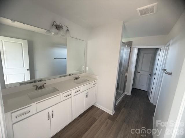 Primary Bath with white cabinets and quartz countertops - 4025 Juno Drive, Charlotte