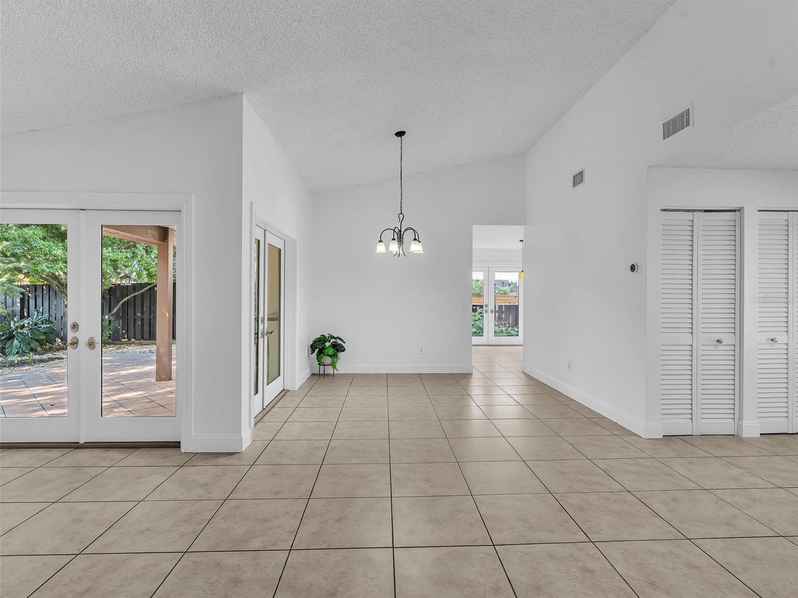 Entertain indoors and out with several access points to the fenced backyard - 5440 SW 155TH CT, MIAMI