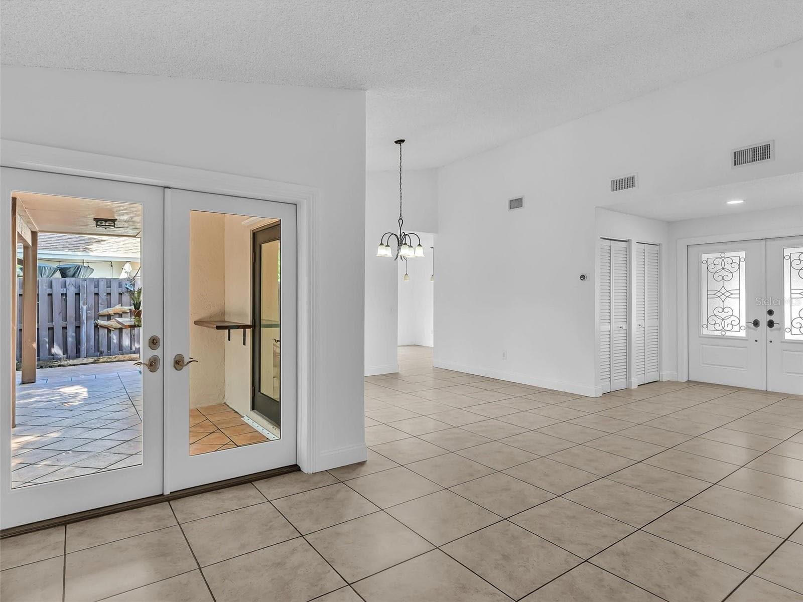Double doors lead to an oversized covered patio - 5440 SW 155TH CT, MIAMI