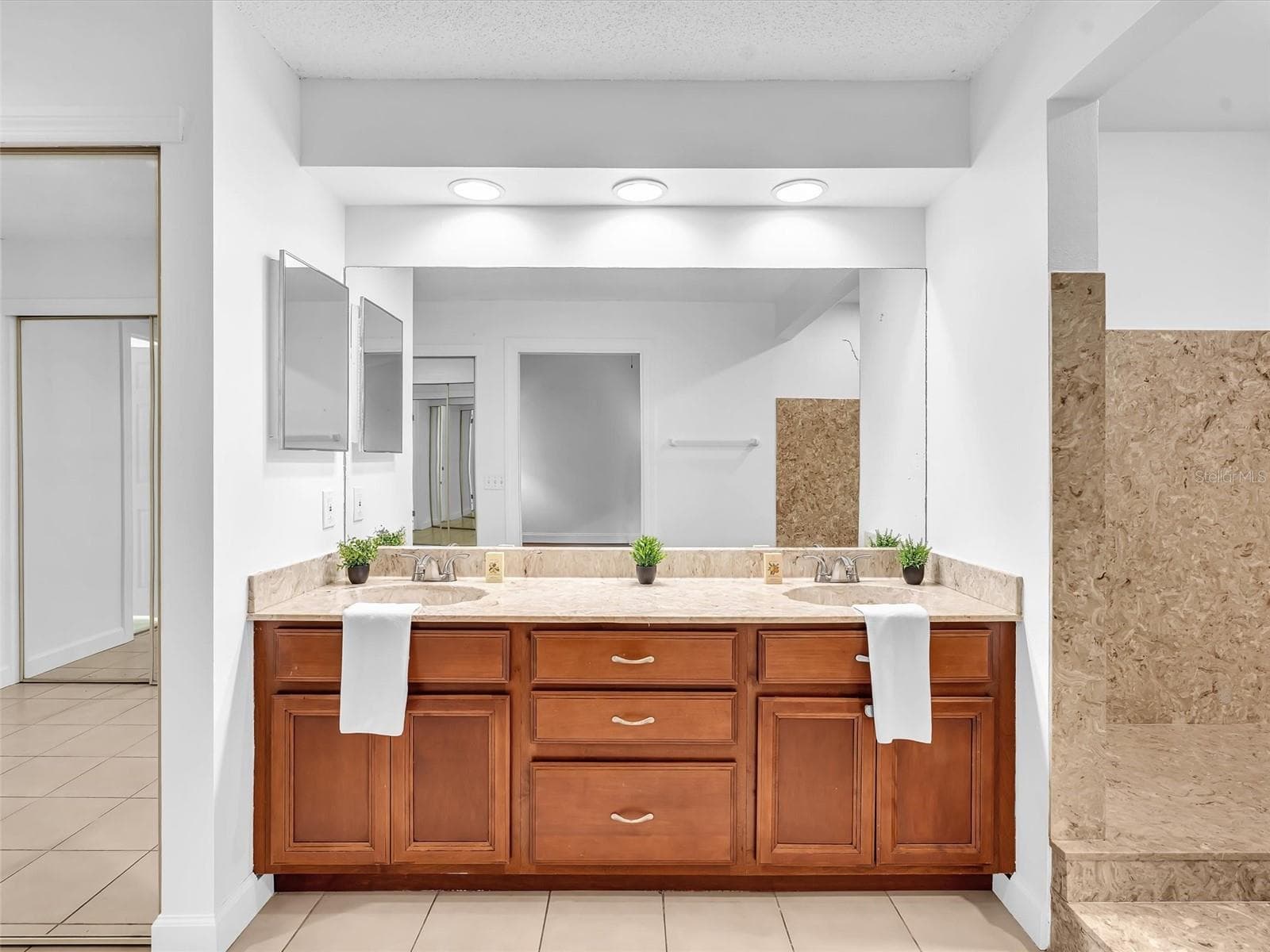 dual vanities and recessed lighting in the primary bath - 5440 SW 155TH CT, MIAMI