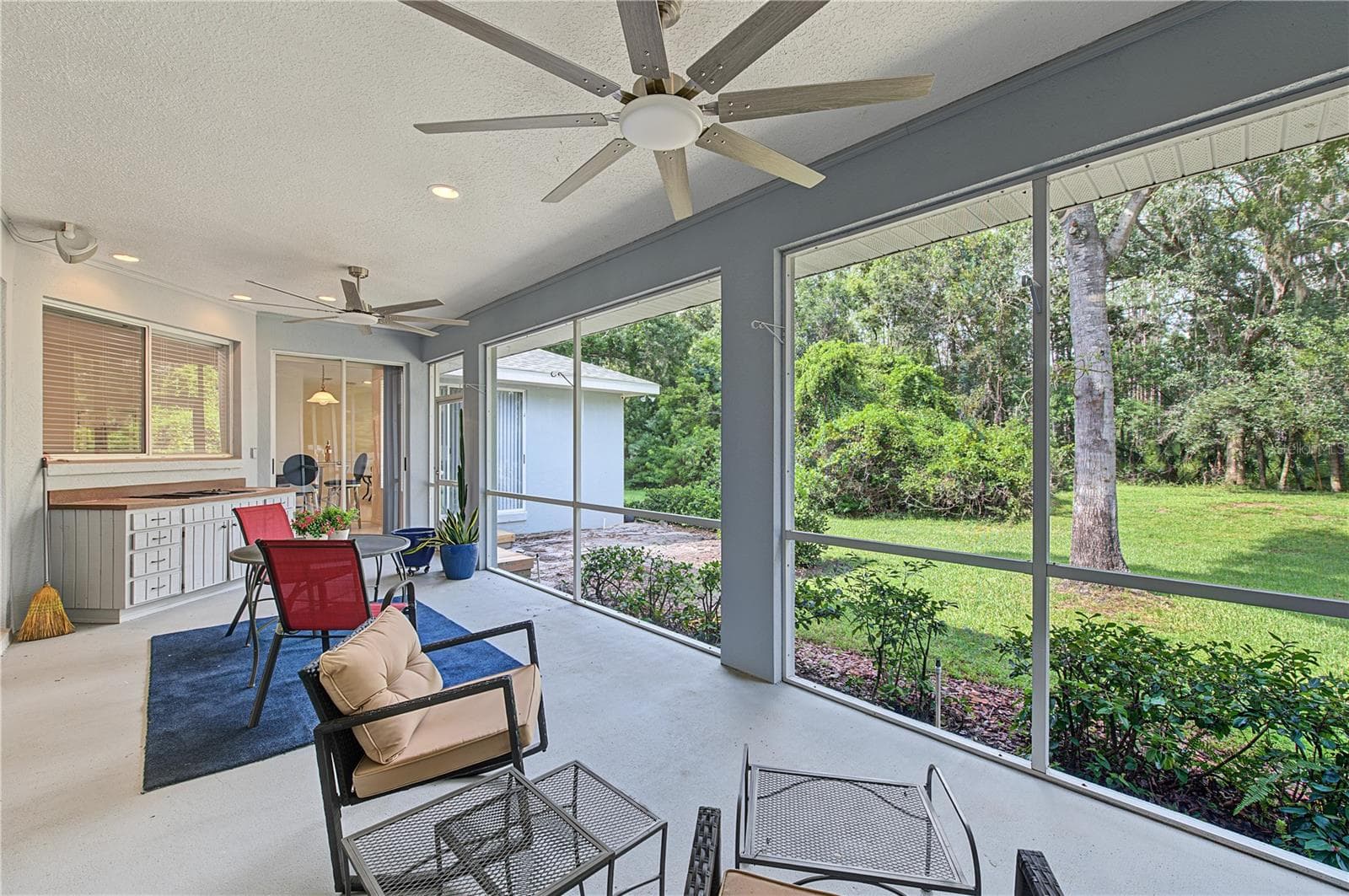 Back Porch with new ceiling fans- French doors off of the master Bedroom - 915 LAKE THOMAS LN, LUTZ