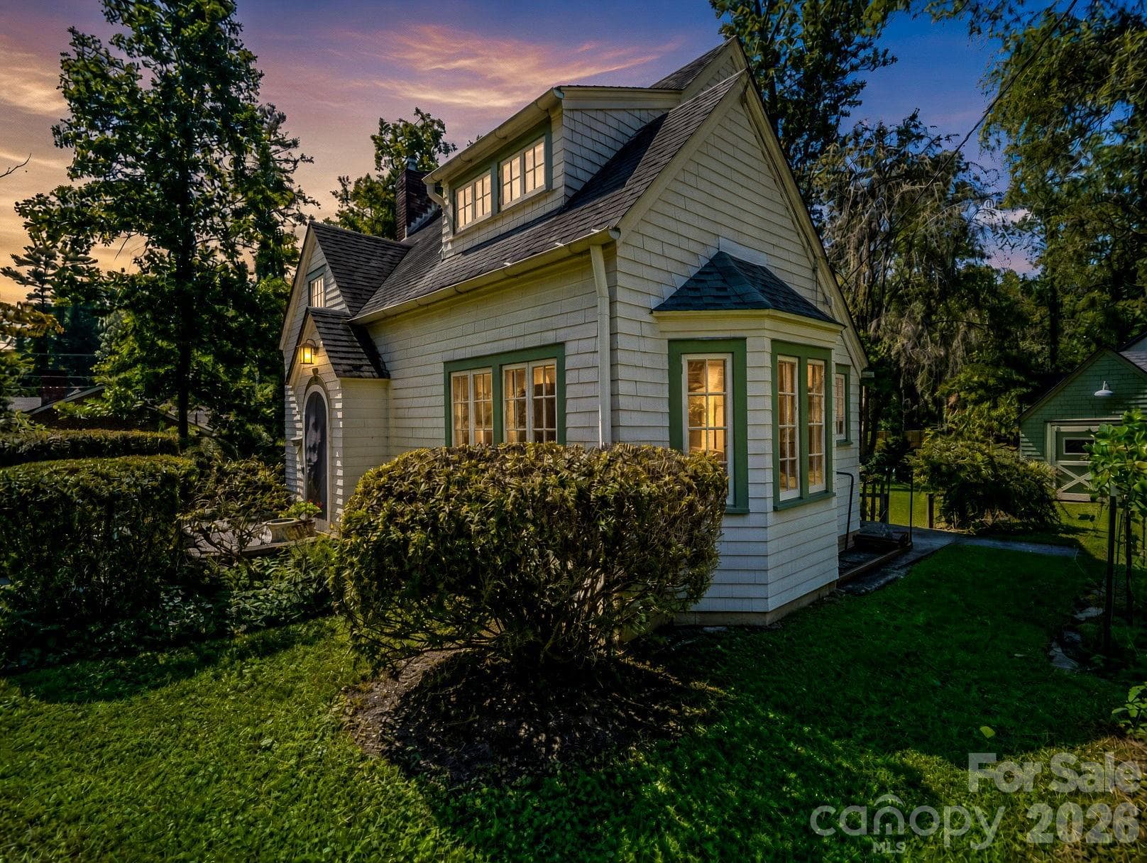 Twilight of the right side showing the bay window - 323 Blythe Street, Hendersonville