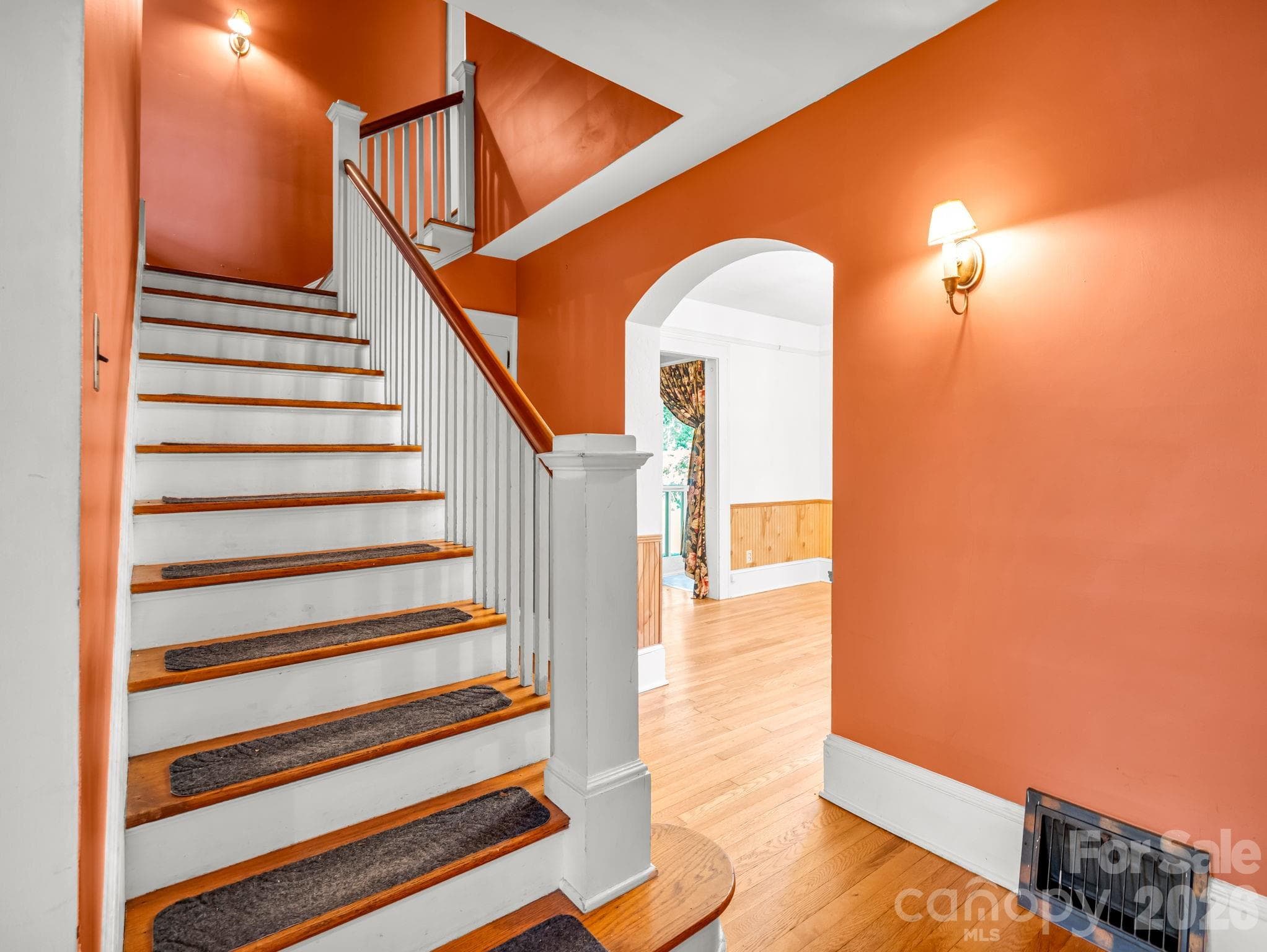 From front door looking into the formal dining room and stairs leading to the 3 bed/1 bath upstairs - 323 Blythe Street, Hendersonville
