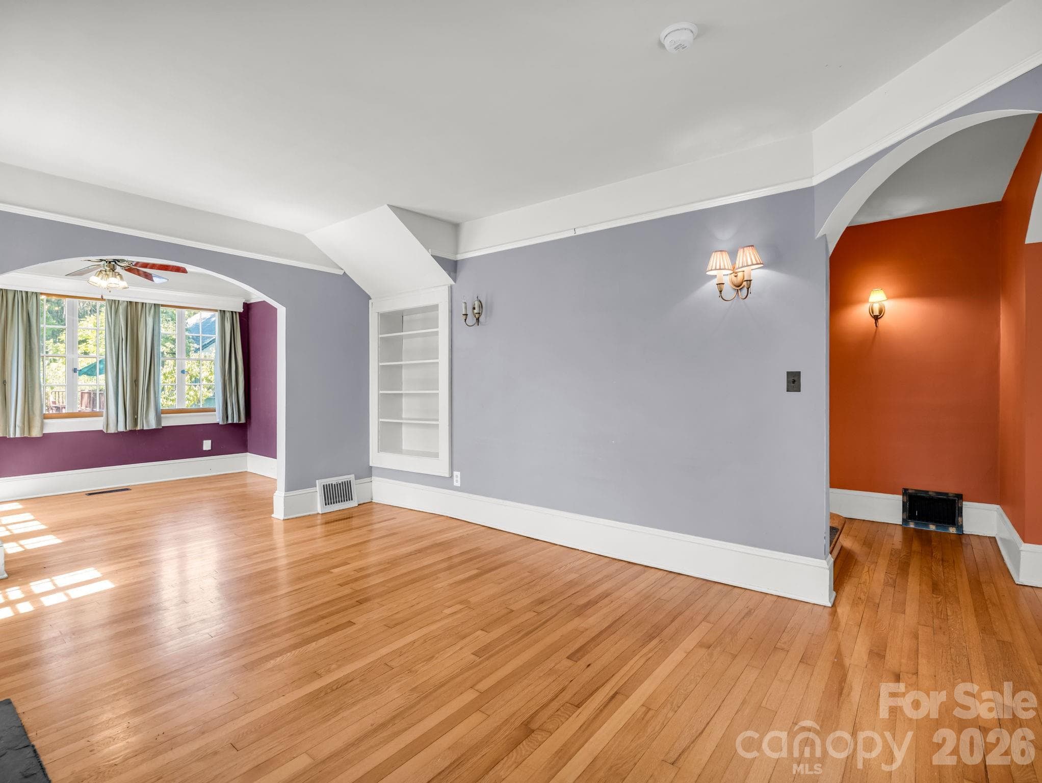 Beautiful arches throughout and built-ins in the living room - 323 Blythe Street, Hendersonville