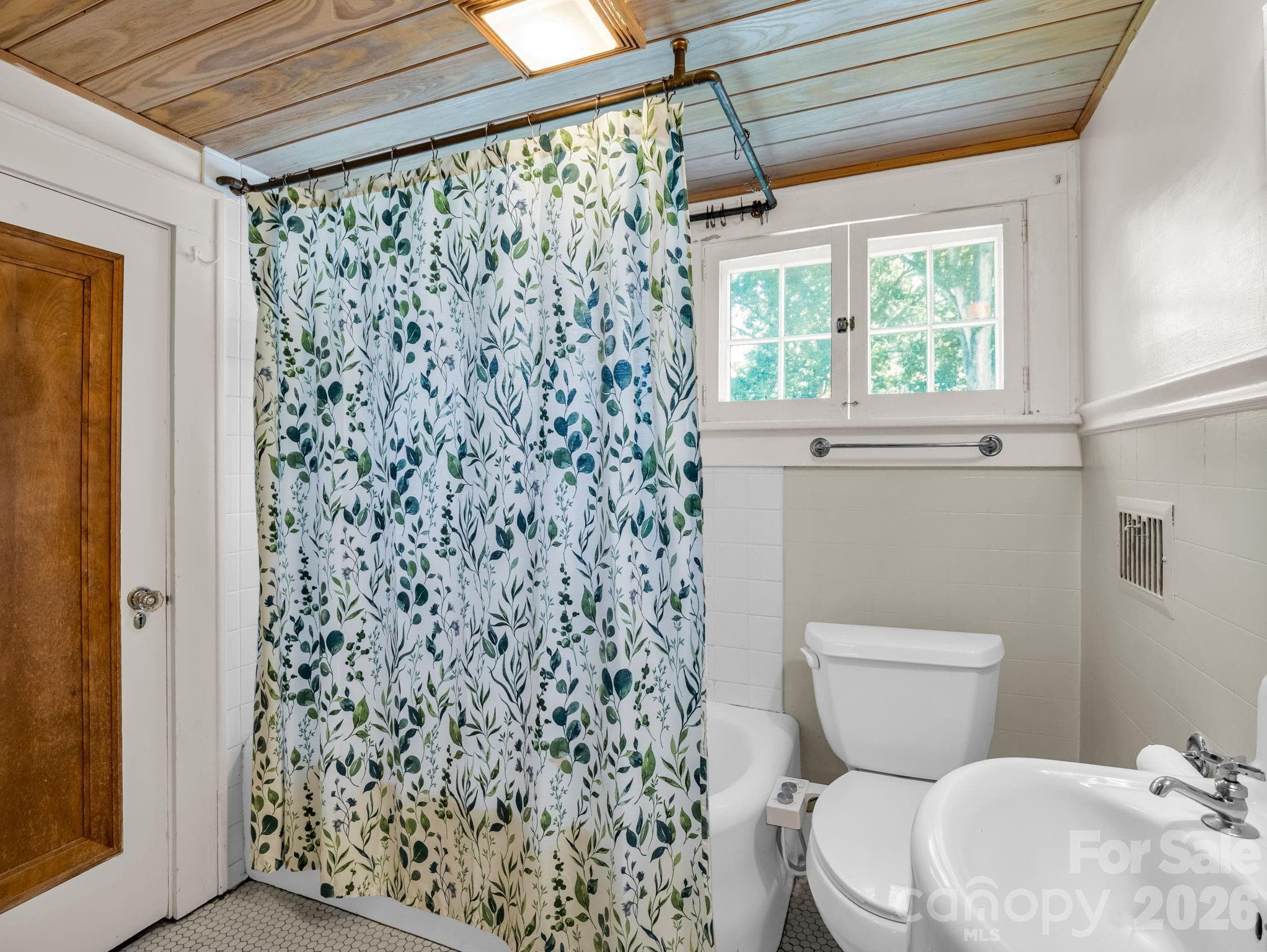 Bathroom with vintage original tub - 323 Blythe Street, Hendersonville