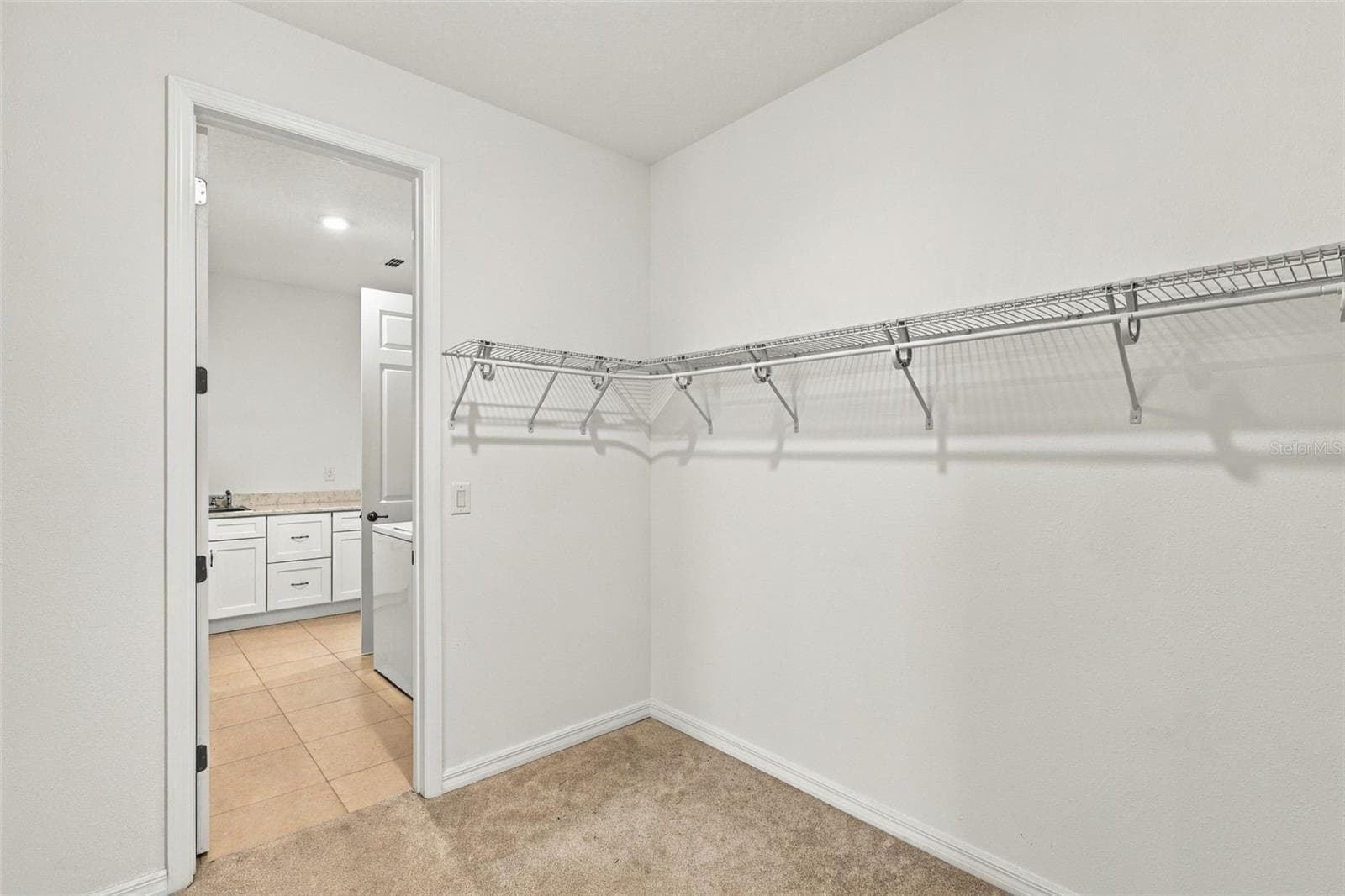 Primary Bedroom Walk in Closet - 10378 SW 96TH LOOP, OCALA