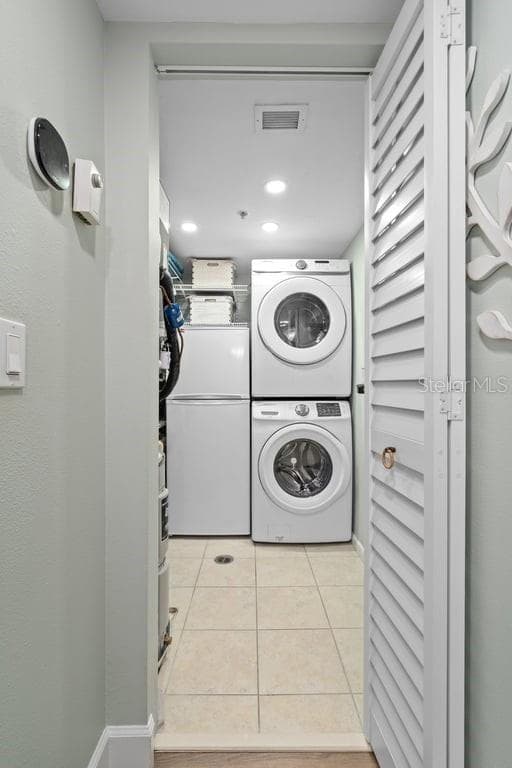 Laundry room with extra refrigerator. - 1660 GULF BLVD #706, CLEARWATER