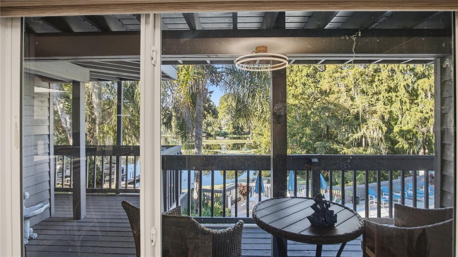 Looking out living room window water view - 20820 RIVER DR #B25, DUNNELLON