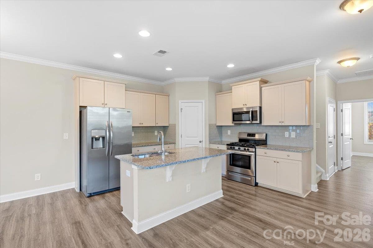granite countertops and kitchen island - 6556 Harris River Way, Charlotte