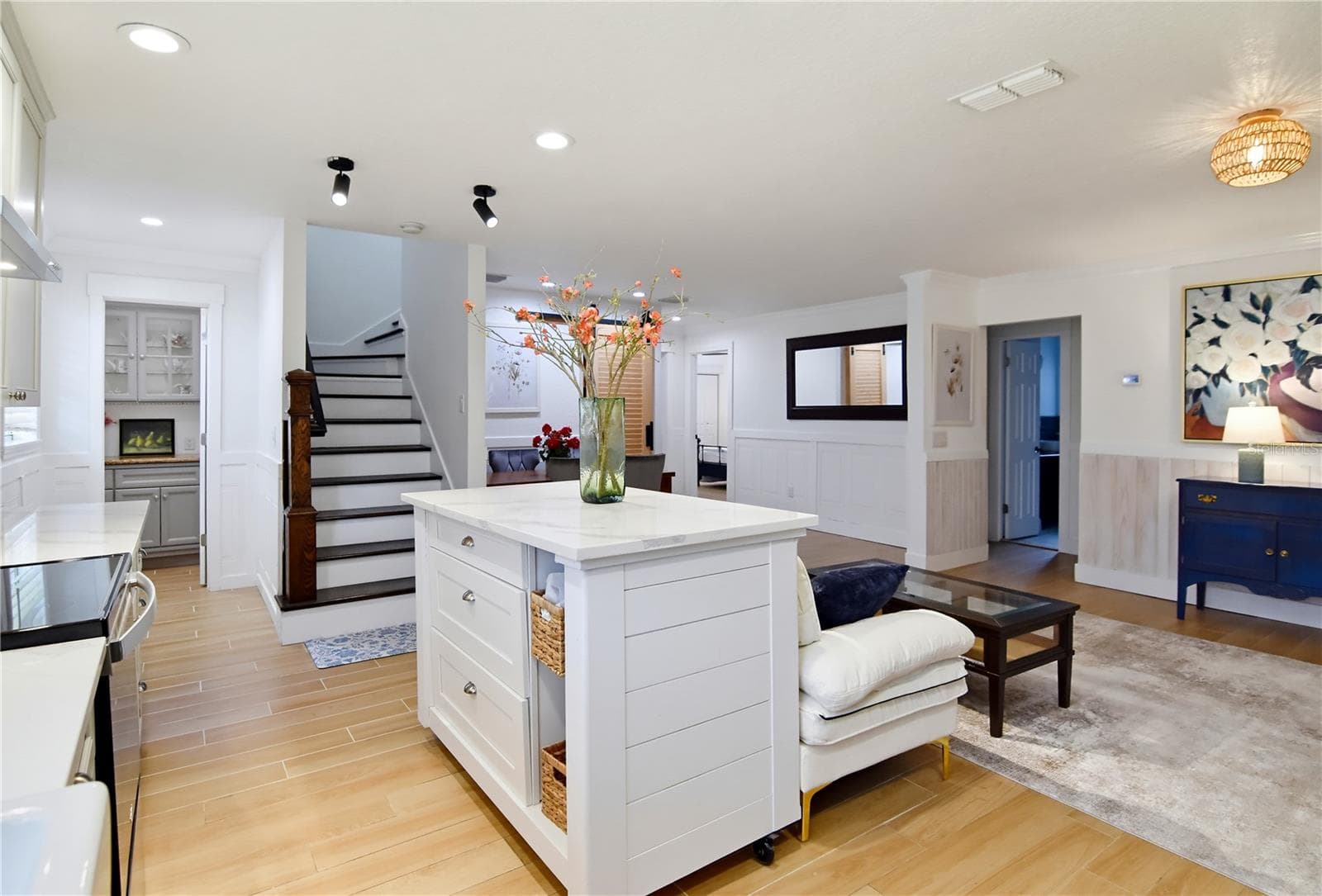 Open living area with abundant natural light and an easy connection to the kitchen and dining room. - 1611 CHESTNUT AVE, WINTER PARK