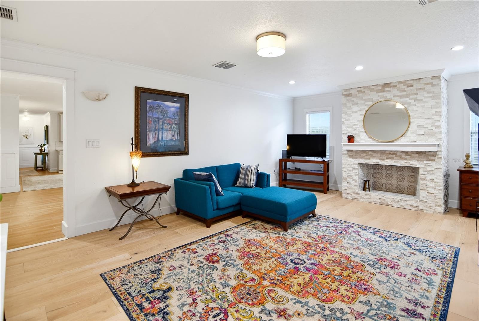 Beautiful stone wood-burning fireplace serves as a focal point of the family room. - 1611 CHESTNUT AVE, WINTER PARK