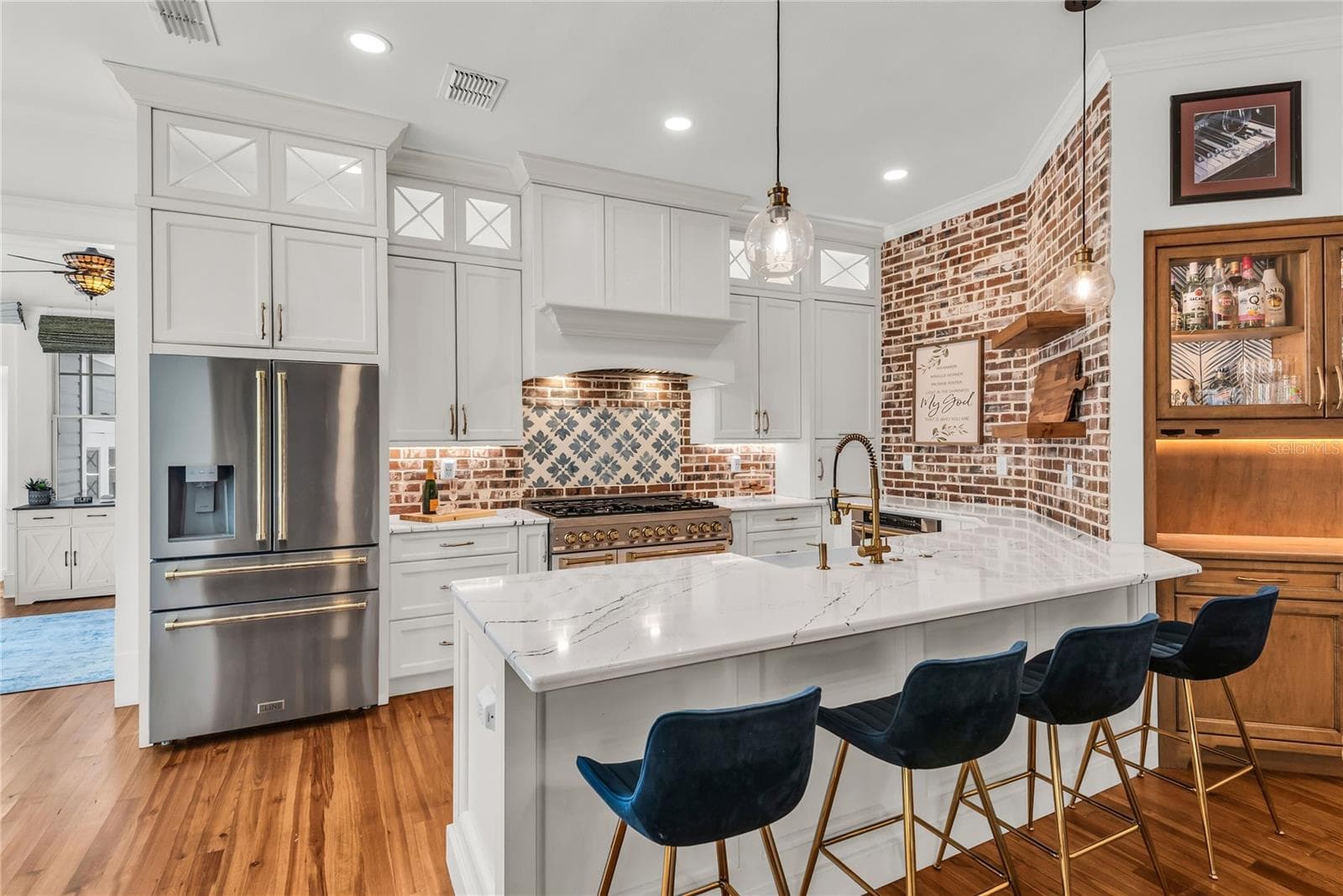 The chef's kitchen is a true focal point with a distinctive mix of old-world charm and modern design that combine luxury and function - 234 N LAKEVIEW AVE, WINTER GARDEN