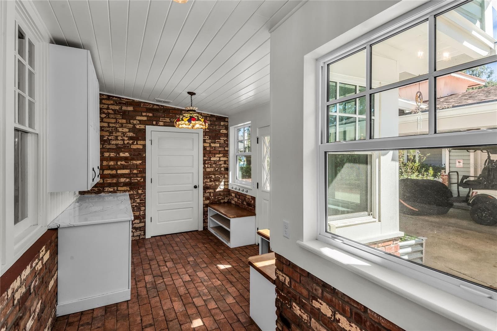 Spacious Mudroom provides entry to carport while a granite countertop, cabinets and a large closet offer both convenience and functionality - 234 N LAKEVIEW AVE, WINTER GARDEN